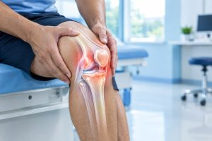Medical illustration of knee joint showing knee pain and anatomy